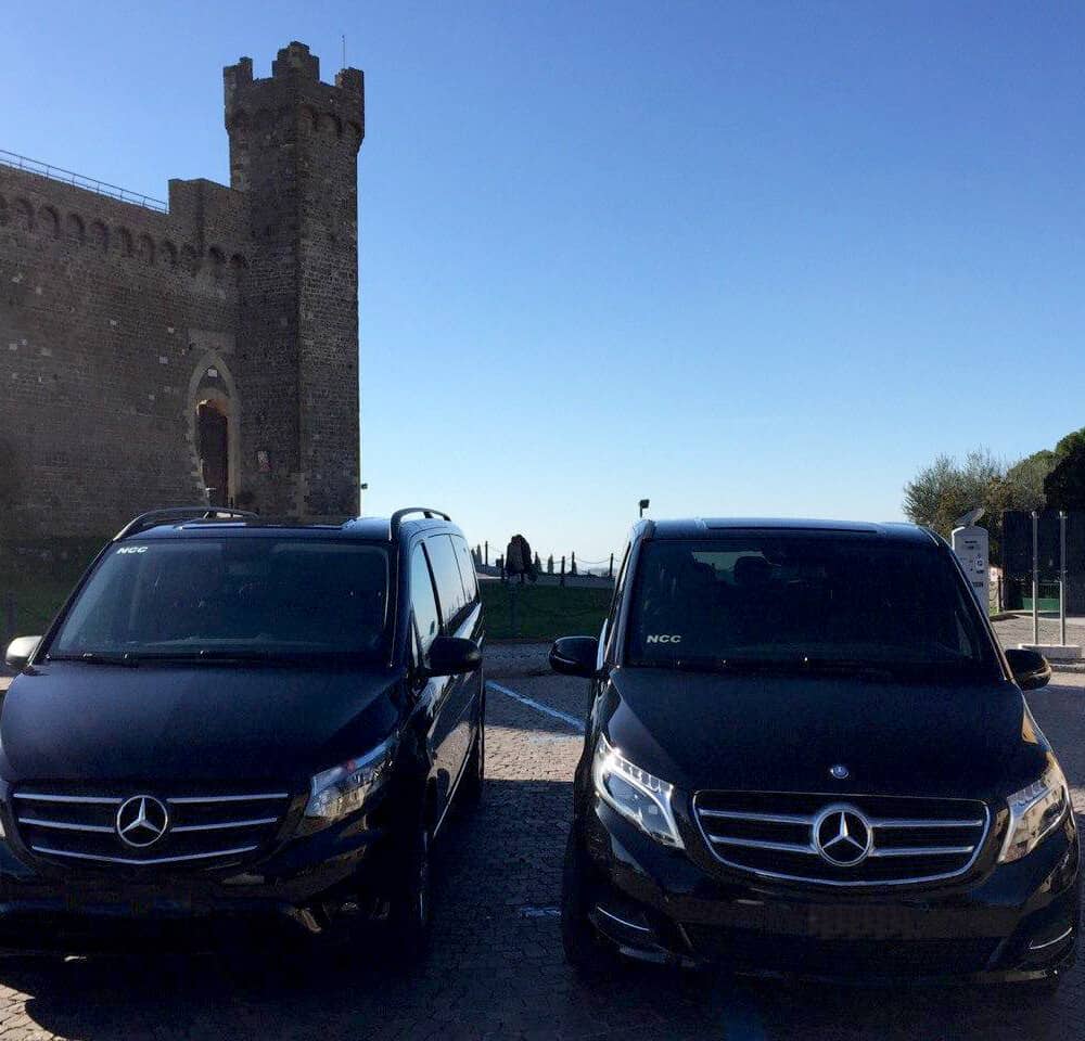 Luxury cars by the Fortress of Montalcino