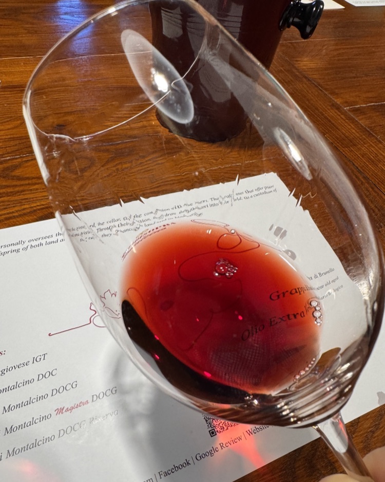 A glass of Brunello di Montalcino 2021 on a tasting table